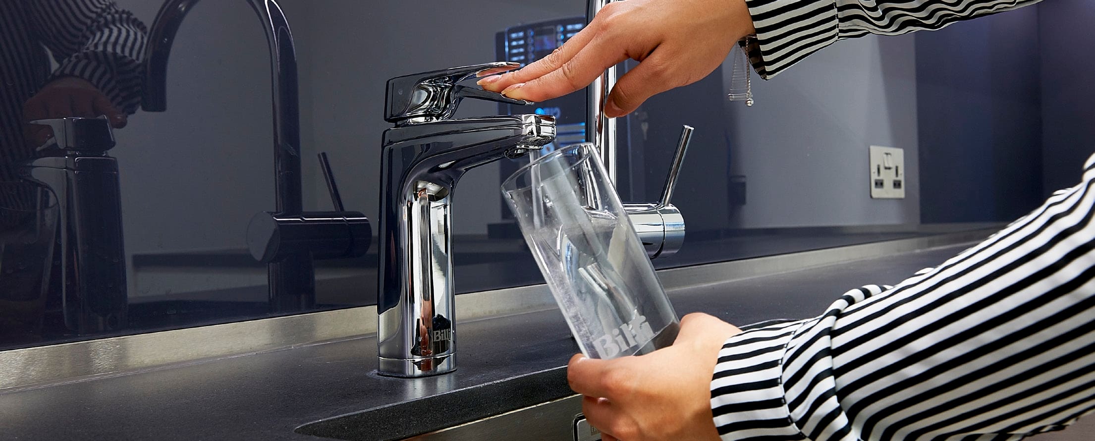 a person filling their glass from a Billi tap